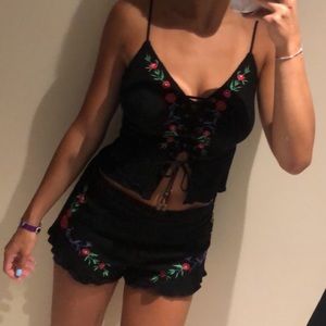 2 piece set, linen fabric, black with floral design, lace up top. Size XS